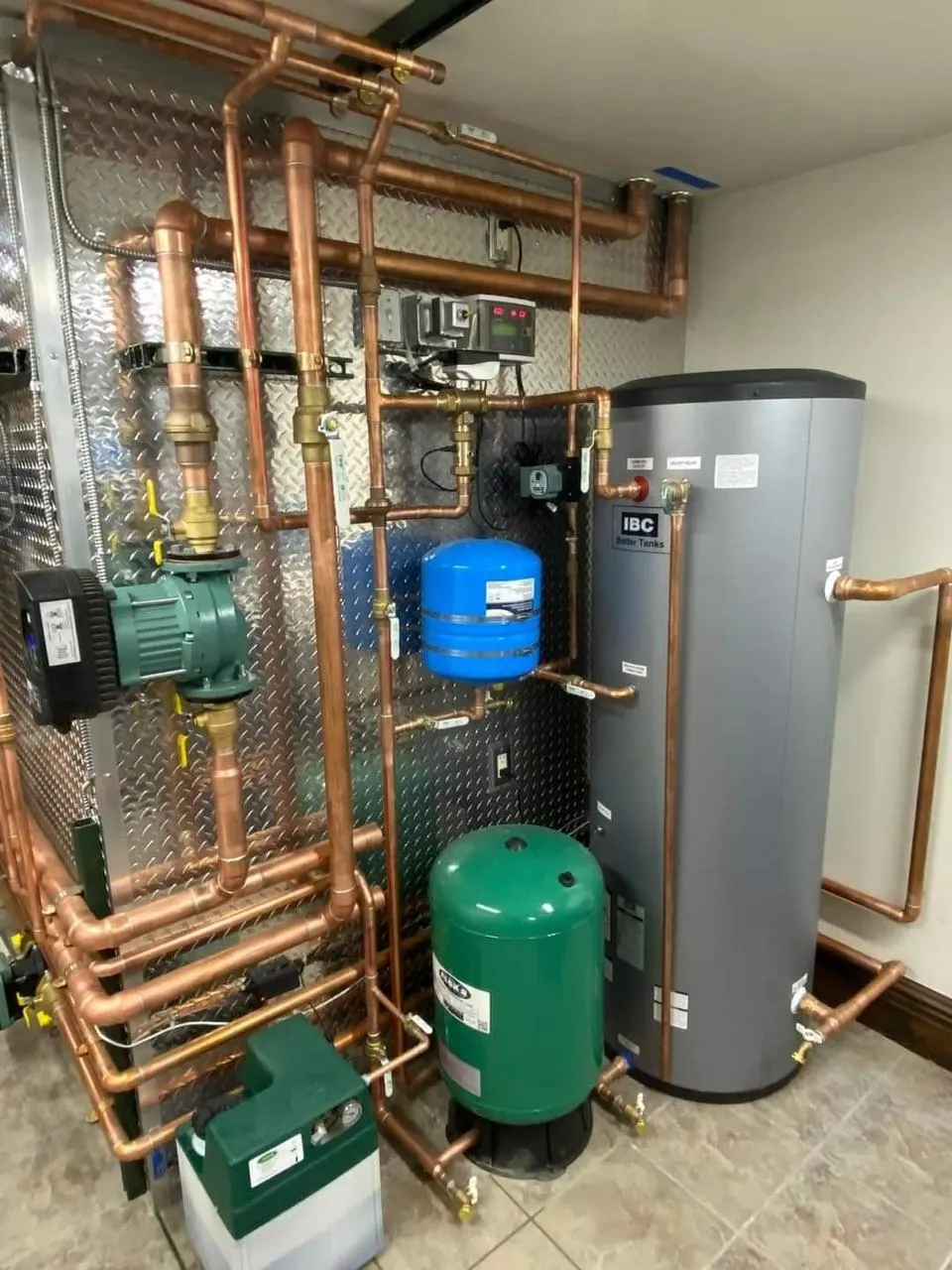 Neatly installed plant room pipework with pumps and tanks